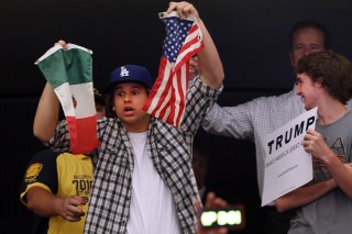 ANAHEIM, CA - MAY 25: A protester is taken away by security from a Donald Trump rally on May 25, 2016 in Anaheim, California. The presumptive Republican presidential candidate is on a Western campaign swing. A rally in Albuquerque, New Mexico turned violent on Tuesday, leading to at least one arrest and several injuries, police say. (Photo by Spencer Platt/Getty Images)