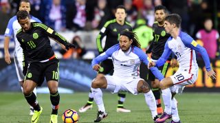 COLUMBUS, OH - NOVEMBER 11: Giovani Dos Santos #10 of Mexico battles for the ball against Jermaine Jones #13 and Christian Pulisic #10 of the United States in the first half during the FIFA 2018 World Cup Qualifier at MAPFRE Stadium on November 11, 2016 in Columbus, Ohio. (Photo by Jamie Sabau/Getty Images)