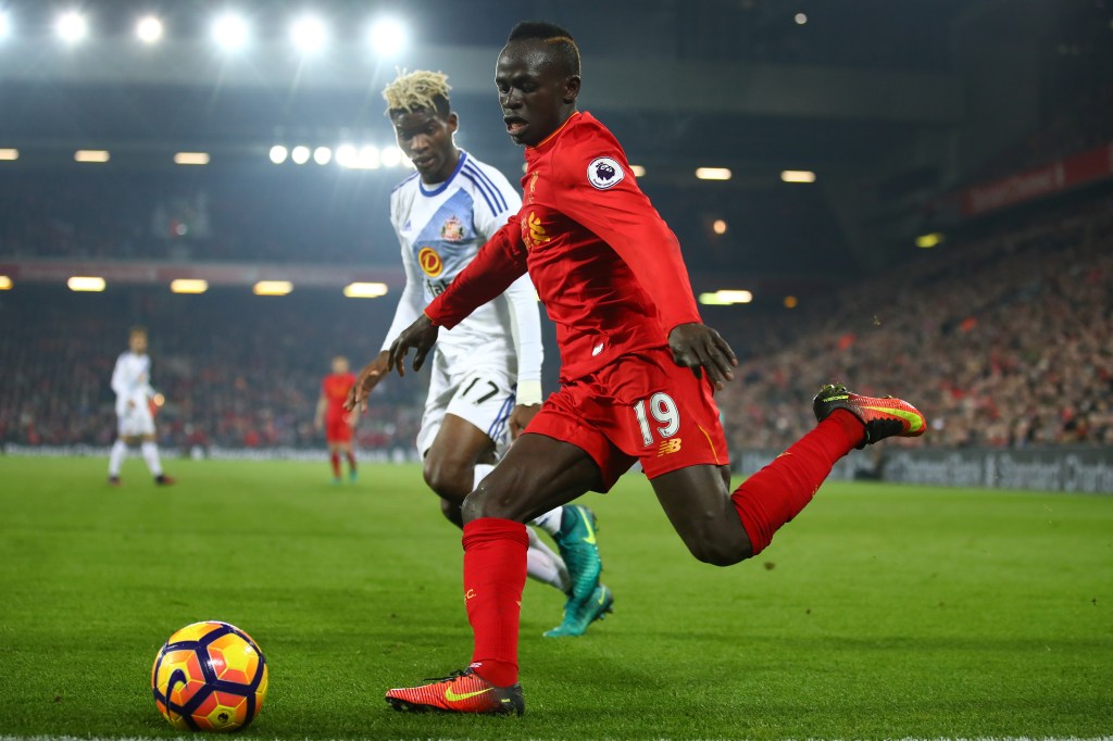 LIVERPOOL, ENGLAND - NOVEMBER 26: Sadio Mane of Liverpool and Dider Ndong of Sunderland compete for the ball during the Premier League match between Liverpool and Sunderland at Anfield on November 26, 2016 in Liverpool, England. (Photo by Clive Brunskill/Getty Images)