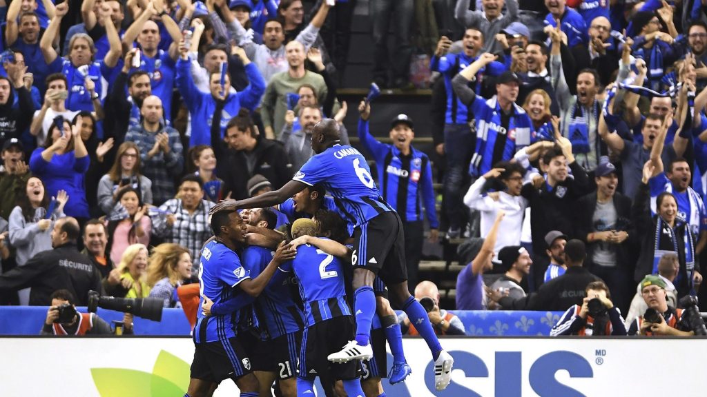 Montreal Impact players celebrate Matteo Mancosu's goal against Toronto FC during the first half of an MLS Eastern Conference final soccer match in Montreal, Tuesday, Nov.22, 2016. (Ryan Remiorz/The Canadian Press via AP)
