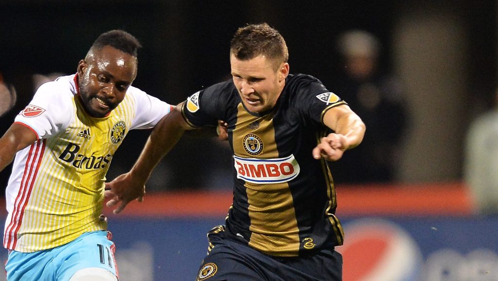 COLUMBUS, OH - MARCH 12: Cedrick Mabwati #11 of the Columbus Crew SC and Keegan Rosenberry #12 of the Philadelphia Union battle for position as they race to control the ball in the second half on March 12, 2016 at MAPFRE Stadium in Columbus, Ohio. Philadelphia defeated Columbus 2-1. (Photo by Jamie Sabau/Getty Images)