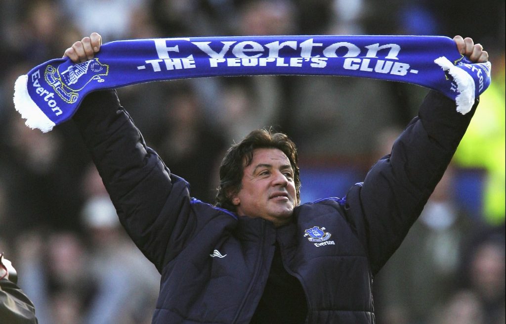 LIVERPOOL, UNITED KINGDOM - JANUARY 14: Hollywood Actor Sylvester Stallone salutes the fans with an Everton scarf prior to the start of the Barclays Premiership match between Everton and Reading at Goodison Park on January 14, 2007 in Liverpool, England. (Photo by Michael Steele/Getty Images)