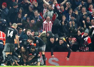 LIVERPOOL, ENGLAND - JANUARY 25: Shane Long of Southampton (not pictured) celebrates with team mates after scoring his sides first goal during the EFL Cup Semi-Final Second Leg match between Liverpool and Southampton at Anfield on January 25, 2017 in Liverpool, England. (Photo by Julian Finney/Getty Images)