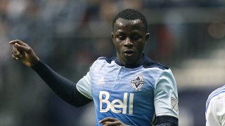 VANCOUVER, BC - MARCH 6: Kekuta Manneh #23 of the Vancouver Whitecaps looks on as Donny Toia #25 of the Montreal Impact plays the ball during their MLS game March 6, 2016 at BC Place in Vancouver, British Columbia, Canada. Montreal won 3-2. (Photo by Jeff Vinnick/Getty Images)