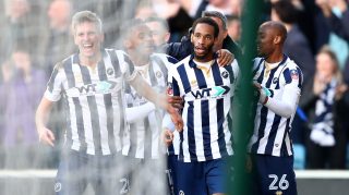 LONDON, ENGLAND - FEBRUARY 18: Shaun Cummings of Millwall (C) celebrates scoring his sides first goal with his Millwall team mates during The Emirates FA Cup Fifth Round match between Millwall and Leicester City at The Den on February 18, 2017 in London, England. (Photo by Clive Rose/Getty Images)