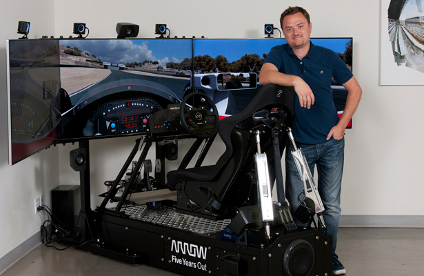 CXC Simulations’ Founder and CEO, Chris Considine in front of the modified Motion Pro II that Sam Schmidt will race in the iRacing Pro Race of Champions on December 16, 2015 – at CXC’s headquarters. Photo: CXC Simulations