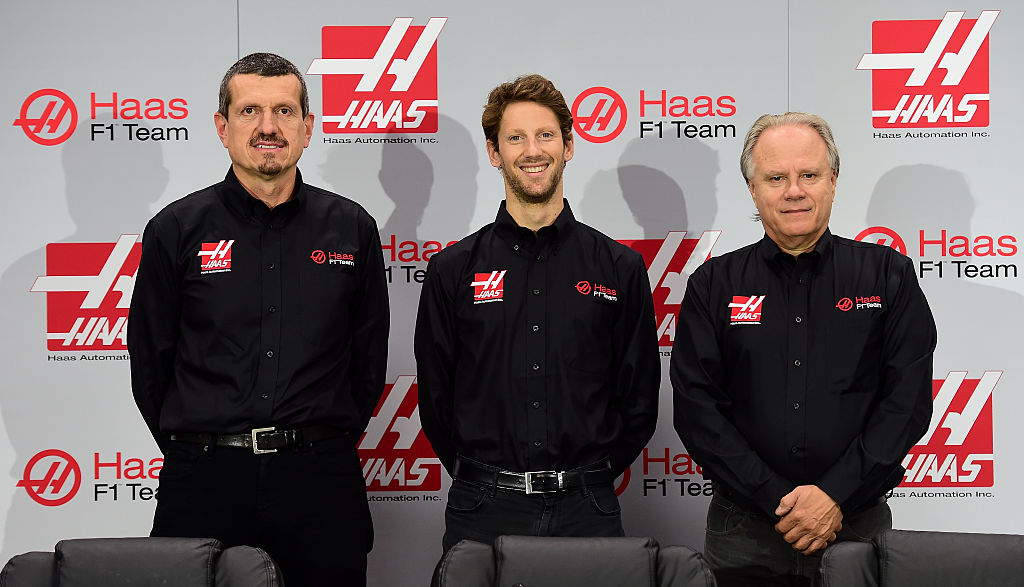 KANNAPOLIS, NC - SEPTEMBER 29:  (L-R) Gunther Steiner, team principal of Haas F1 Team, Romain Grosjean of France, and Gene Haas, owner of Haas F1 Team, pose for a photo opportunity after Haas F1 Team announced Grosjean as their driver for the upcoming 2016 Formula 1 season on September 29, 2015 in Kannapolis, North Carolina.  (Photo by Jared C. Tilton/Stewart-Haas Racing via Getty Images)