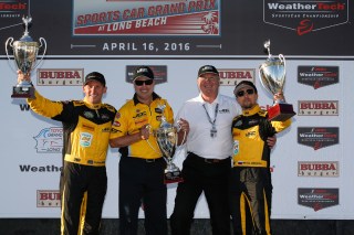 Simpson (far left) played spotter for Hildebrand in Indy. Photo courtesy of IMSA