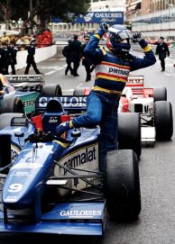 Olivier Panis with arms aloft climbs from his #9 Equipe Ligier Gauloises Blondes Ligier JS43 Mugen-Honda 3.0 V10 to celebrate victory at the Grand Prix of Monaco on 19th May 1996 on the streets of the Principality of Monaco in Monte Carlo, Monaco.(Photo by Pascal Rondeau/Getty Images)