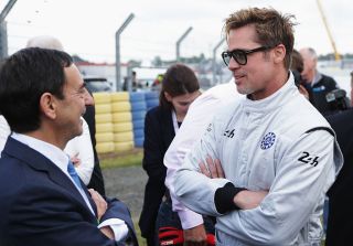LE MANS, FRANCE - JUNE 18: Actor Brad Pitt (R) talks with ACO President Pierre Fillon (L) before the Le Mans 24 Hour race at the Circuit de la Sarthe on June 18, 2016 in Le Mans, France. (Photo by Ker Robertson/Getty Images)