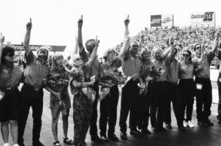 The friends and family of Blaine Johnson salute his memory in a touching starting-line ceremony prior to the start of the final eliminations of the 1996 U.S. Nationals in suburban Indianapolis.