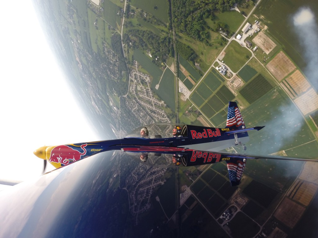 Indycar driver Alexander Rossi rides in Red Bull Air Race Pilot Kirby Chambliss' plane in Indianapolis, Indiana, USA on 01 August 2016.