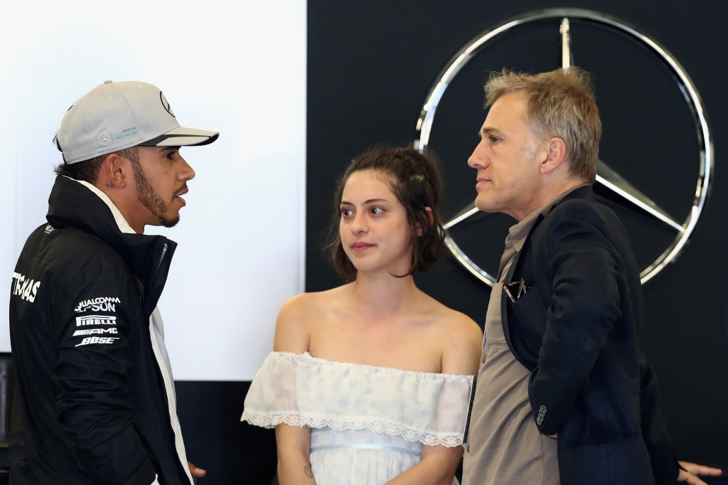 AUSTIN, TX - OCTOBER 22: Lewis Hamilton of Great Britain and Mercedes GP talks with actors Christoph Waltz and Rosa Salazar in the garage during final practice for the United States Formula One Grand Prix at Circuit of The Americas on October 22, 2016 in Austin, United States. (Photo by Lars Baron/Getty Images)
