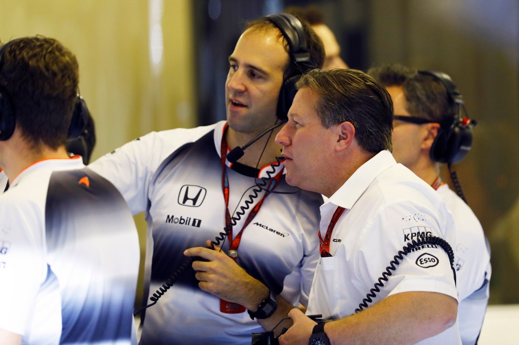 Zak Brown and Tom Stallard in the garage.