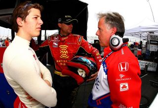 RICHMOND, VA - JUNE 23: Marco Andretti, (L) driver of the #26 ArcaEx Andretti Green Racing Dallara Honda, and Bryan Herta driver of the #7 XM Satellite Andretti Green Racing Dallara Honda, and Marco's engineer Eddie Jones talk during practice for the IRL IndyCar Series SunTrust Indy challenge on June 23, 2006 at Richmond International Raceway in Richmond, Virginia. (Photo by Gavin Lawrence/Getty Images)