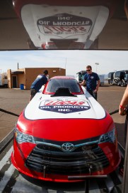 Del Worsham unloads his Funny Car Thursday in Phoenix.