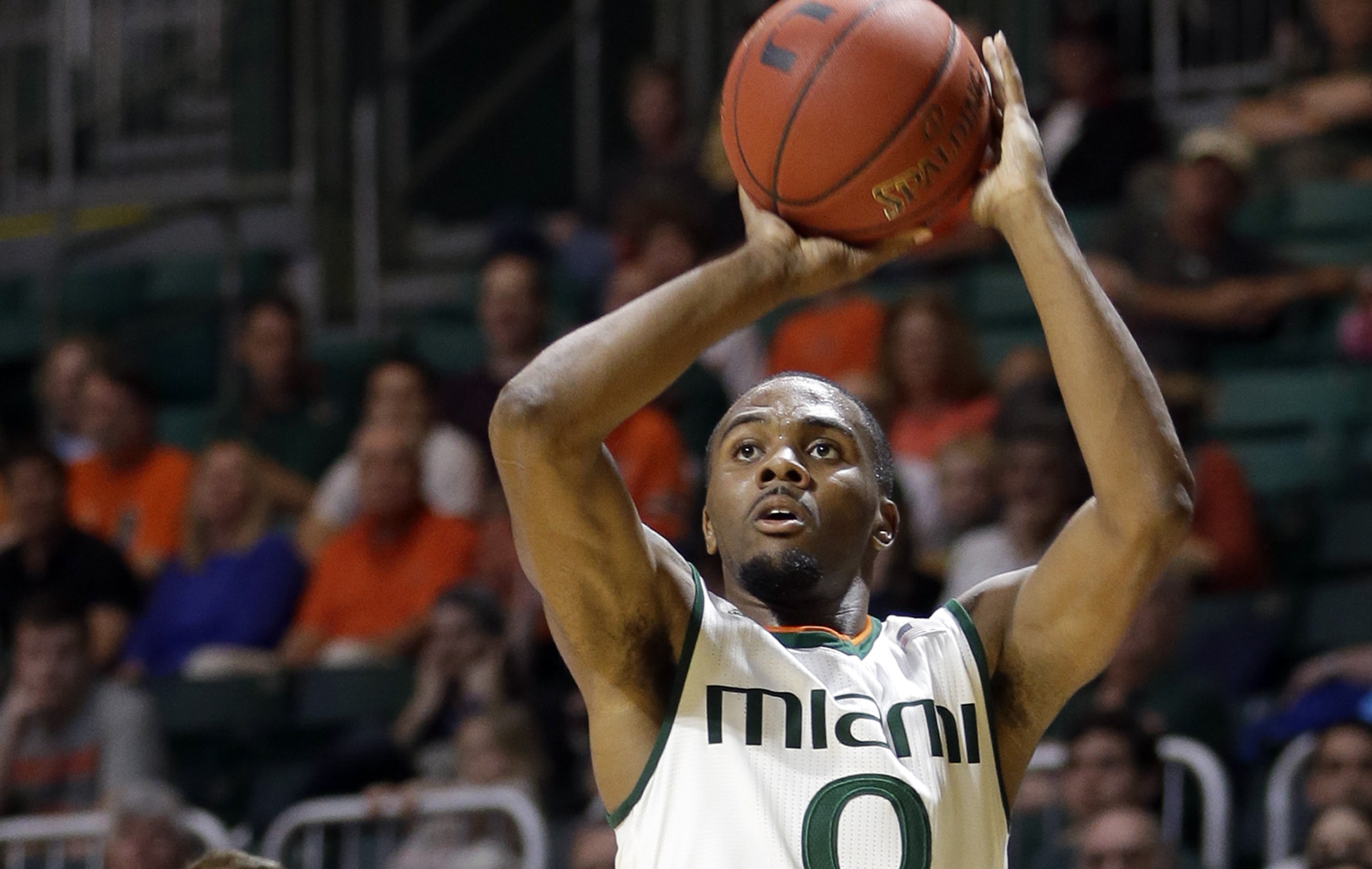 Miami guard Ja'Quan Newton (0) prepares to shoot against Charlotte during the first half of an NCAA college basketball game, Saturday, Dec. 5, 2015, in Coral Gables, Fla. (AP Photo/Alan Diaz)