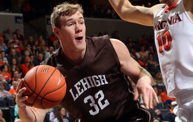 Lehigh center Tim Kempton (32) is defended by Virginia center Mike Tobey (10) during an NCAA college basketball game, Wednesday Nov. 25, 2015, in Charlottesville, Va. (AP Photo/Andrew Shurtleff)