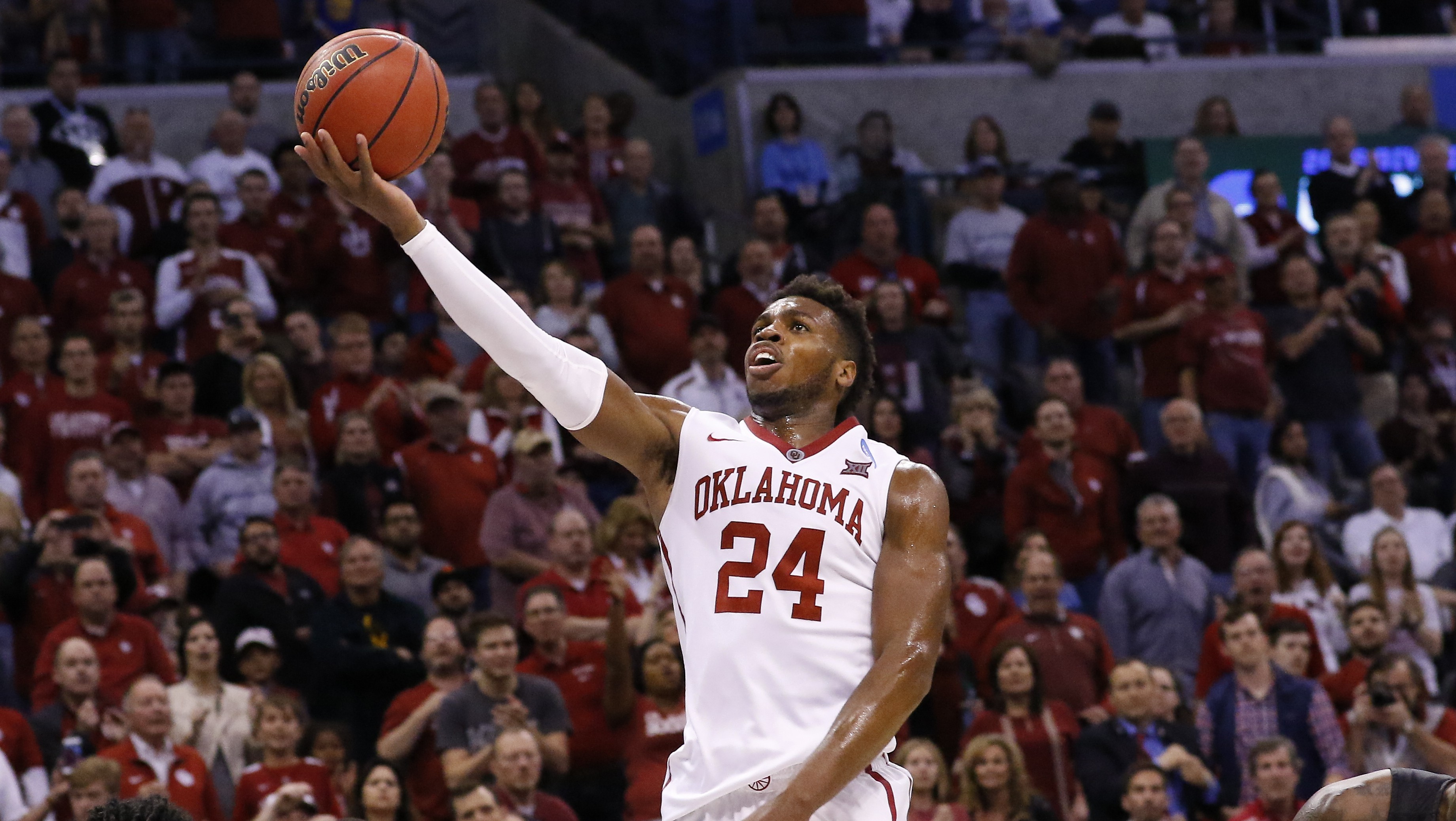 Oklahoma guard Buddy Hield (24) goes up for a basket against VCU in the second half during a second-round men's college basketball game in the NCAA Tournament in Oklahoma City, Sunday, March 20, 2016. Oklahoma won 85-81. (AP Photo/Alonzo Adams)