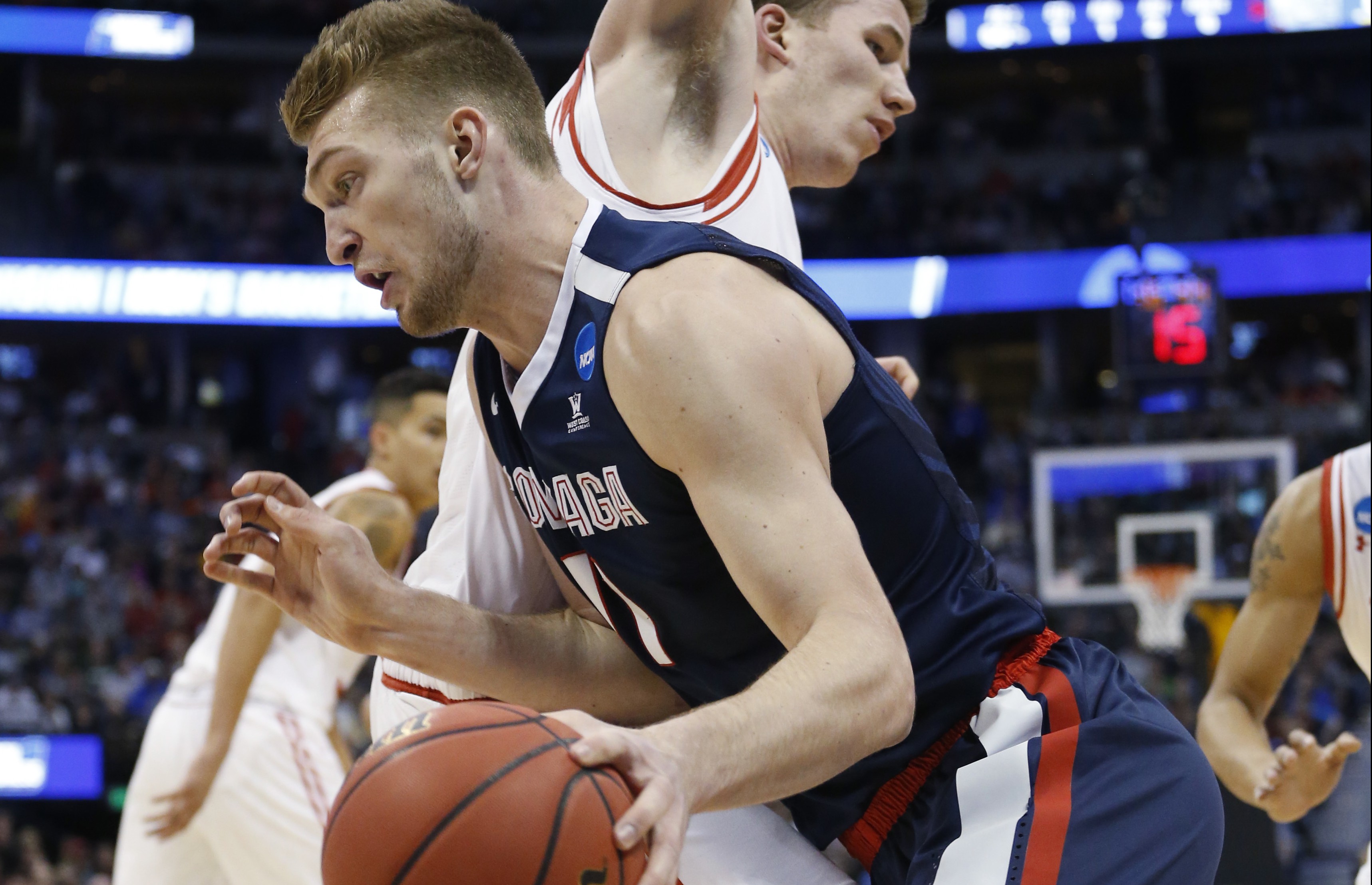 Gonzaga forward Domantas Sabonis, front, drives past Utah forward Jakob Poeltl during the first half of a second-round men's college basketball game Saturday, March 19, 2016, in the NCAA Tournament in Denver. (AP Photo/Brennan Linsley)