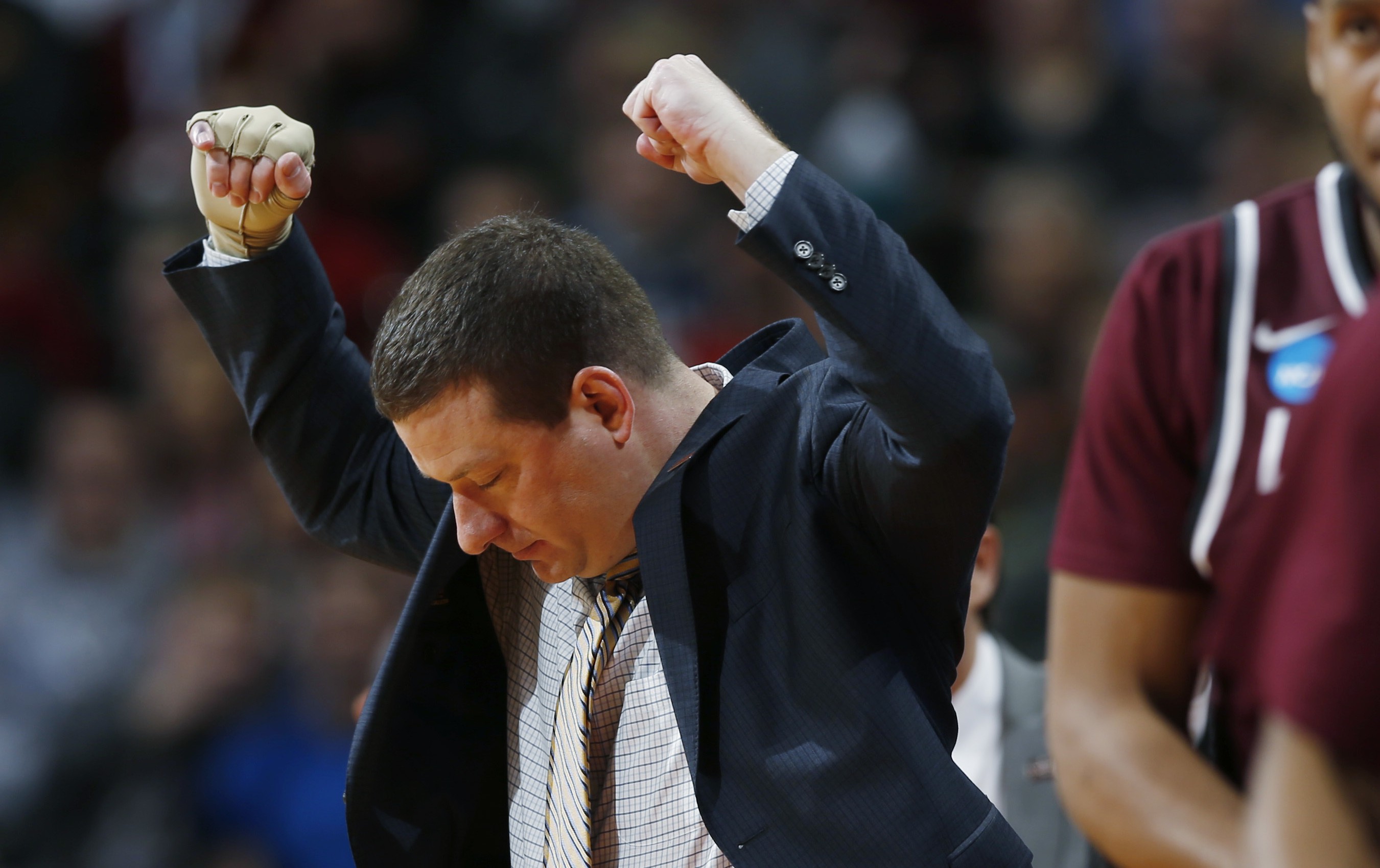 Arkansas Little Rock head coach Chris Beard reacts after his team draws a foul against Iowa State during the first half of a second-round men's college basketball game Saturday, March 19, 2016, in the NCAA Tournament in Denver. (AP Photo/David Zalubowski)