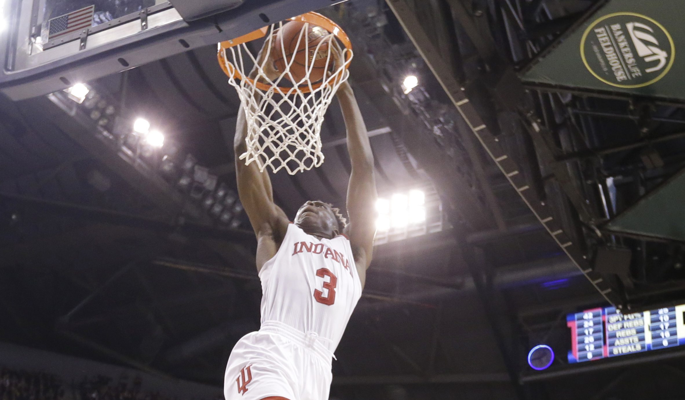 Indiana's OG Anunoby (3) dunks in the second half of an NCAA college basketball game against the Michigan in the quarterfinals at the Big Ten Conference tournament, Friday, March 11, 2016, in Indianapolis. Michigan won 72-69. (AP Photo/Michael Conroy)