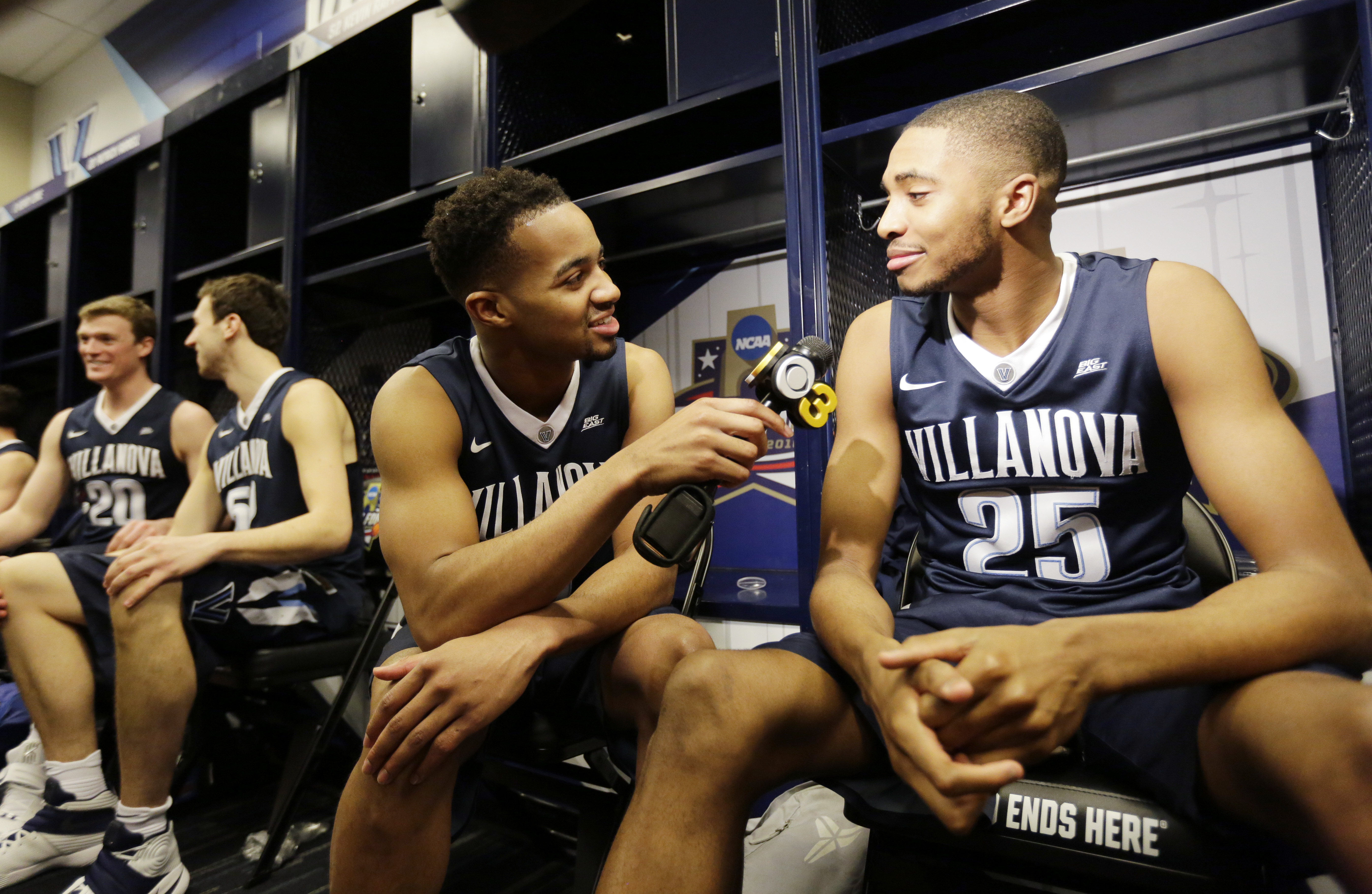 Villanova's Phil Booth interviews teammate Mikal Bridges (25) in the locker room before a practice session for the NCAA Final Four college basketball tournament Thursday, March 31, 2016, in Houston. (AP Photo/Eric Gay)