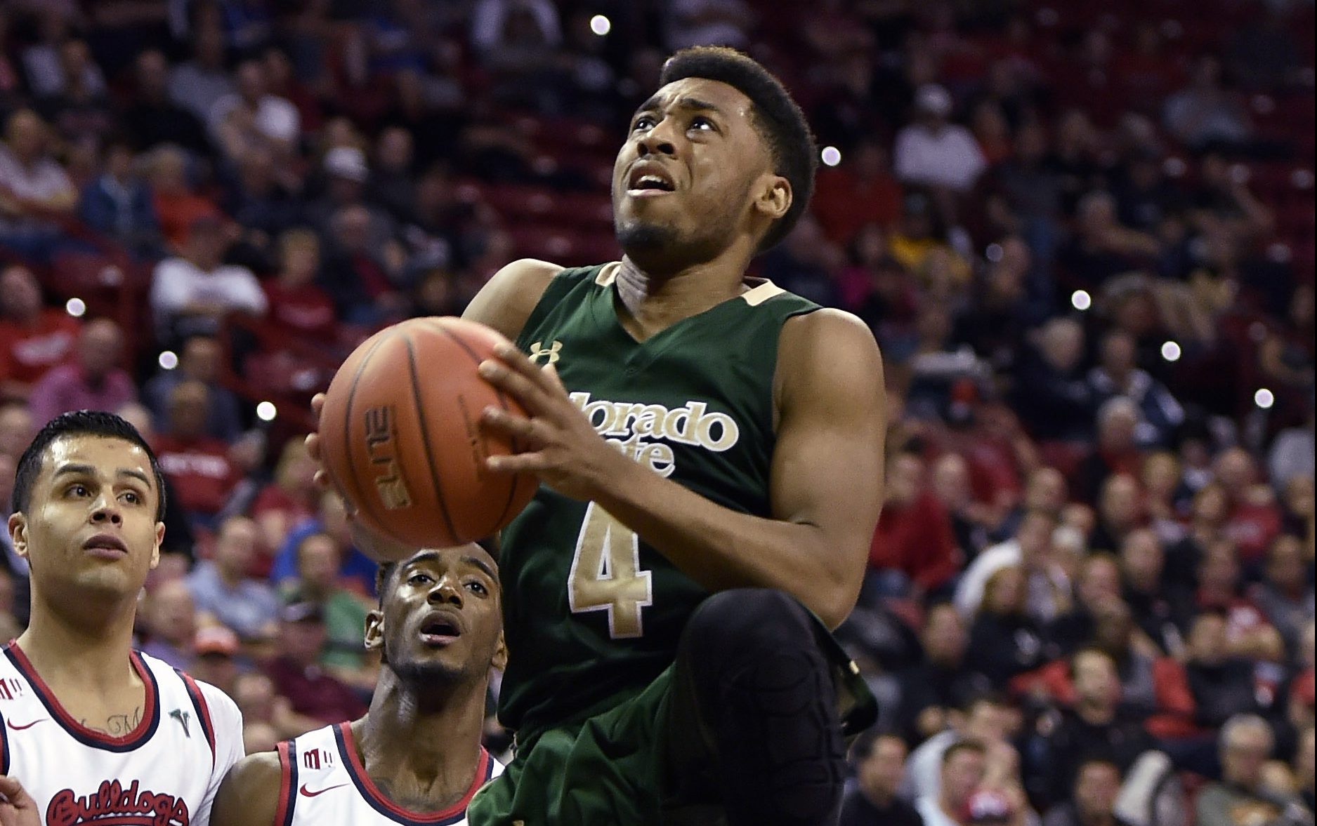 Colorado State's John Gillon (4) shoots against Fresno State during the first half of an NCAA college basketball game in the semifinals at the Mountain West Conference men's tournament Friday, March 11, 2016, in Las Vegas. (AP Photo/David Becker)