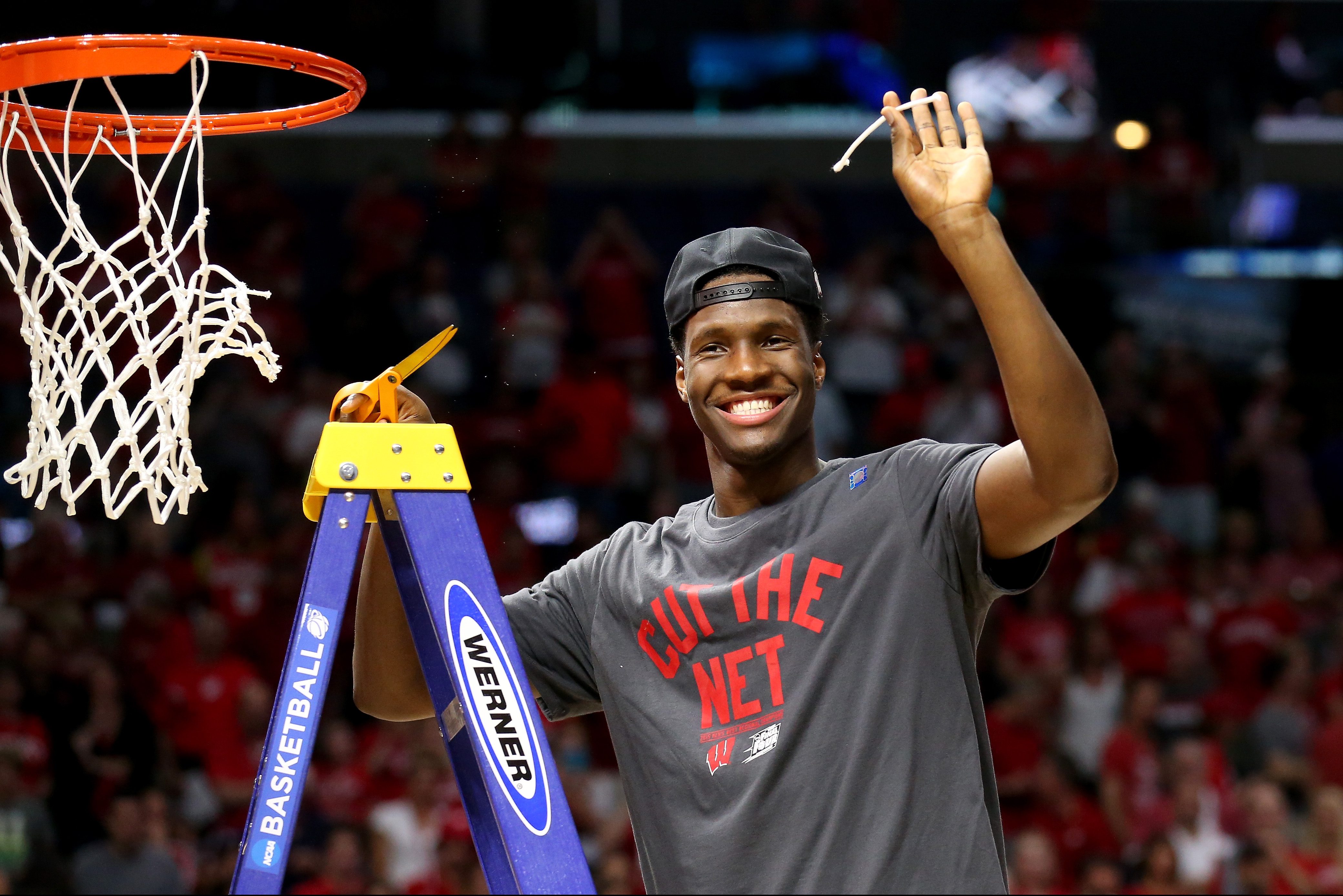 LOS ANGELES, CA - MARCH 28: Nigel Hayes #10 of the Wisconsin Badgers cuts the net after the Badgers 85-78 victory against the Arizona Wildcats during the West Regional Final of the 2015 NCAA Men's Basketball Tournament at Staples Center on March 28, 2015 in Los Angeles, California. (Photo by Stephen Dunn/Getty Images)