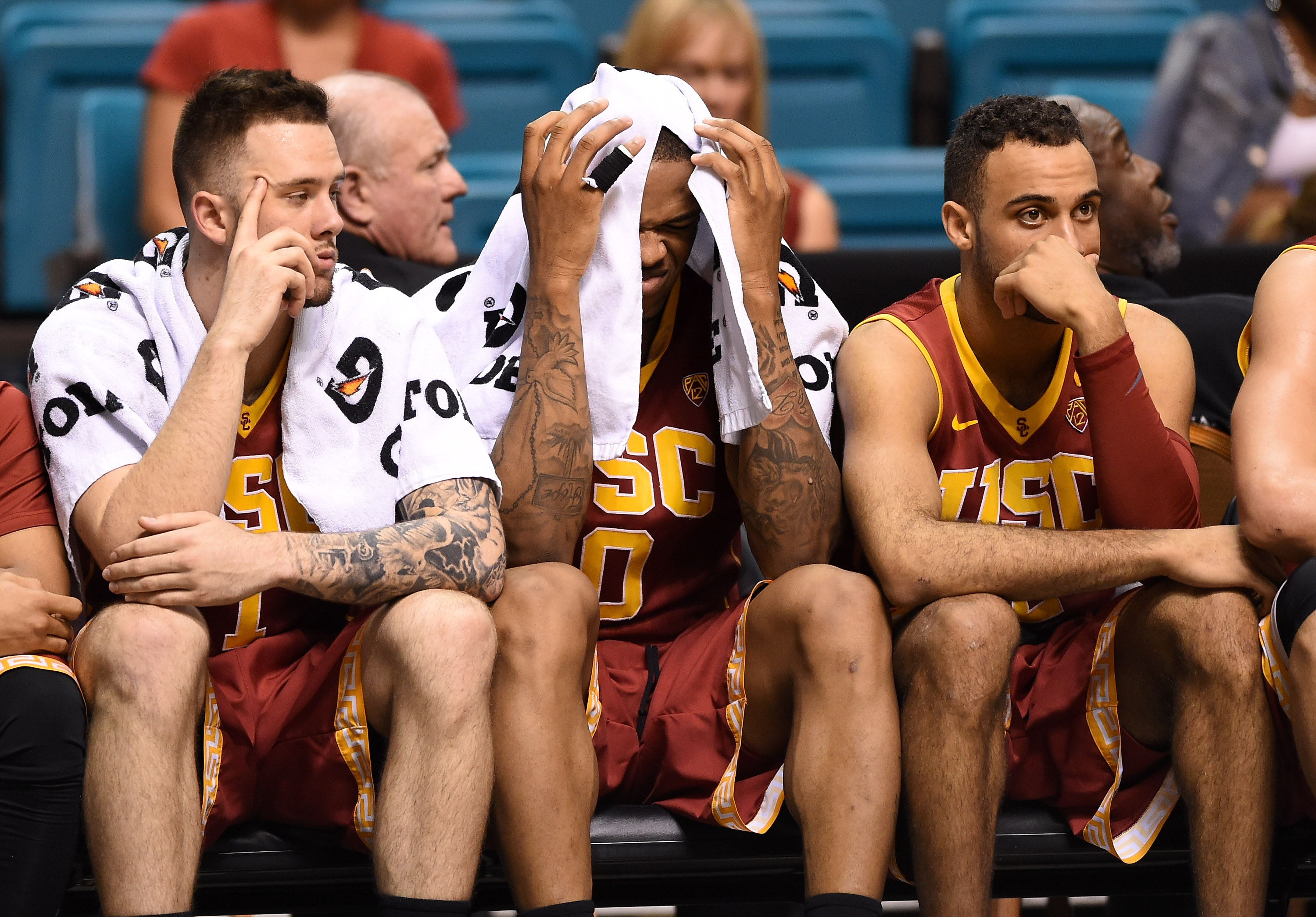 LAS VEGAS, NV - MARCH 12:  (L-R) Katin Reinhardt #1, Darion Clark #0 and Julian Jacobs #12 of the USC Trojans react on the bench late in their 96-70 loss to the UCLA Bruins in a quarterfinal game of the Pac-12 Basketball Tournament at the MGM Grand Garden Arena on March 12, 2015 in Las Vegas, Nevada.  (Photo by Ethan Miller/Getty Images)