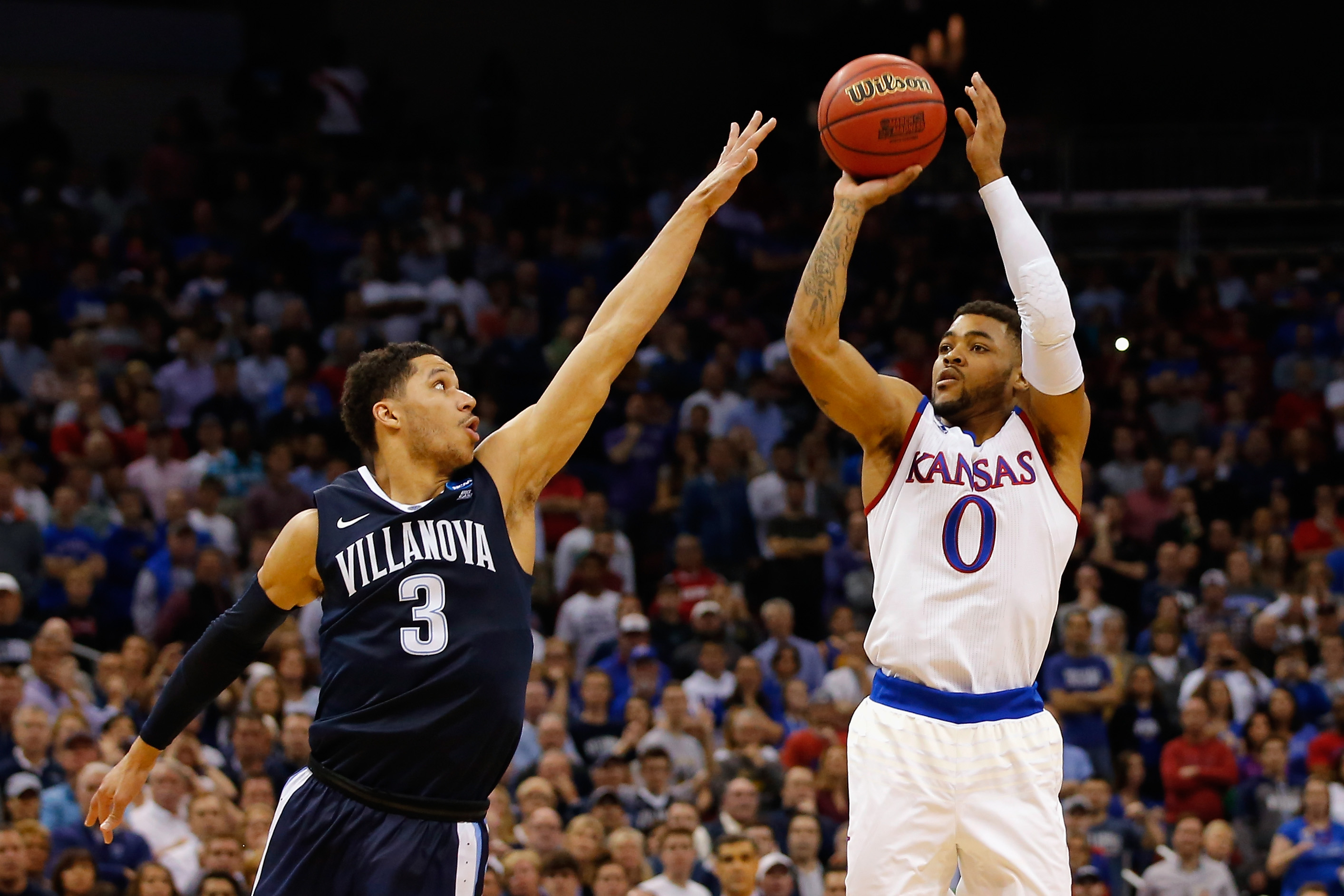 LOUISVILLE, KY - MARCH 26: Frank Mason III #0 of the Kansas Jayhawks shoots the ball against Josh Hart #3 of the Villanova Wildcats in the second half during the 2016 NCAA Men's Basketball Tournament South Regional at KFC YUM! Center on March 26, 2016 in Louisville, Kentucky. (Photo by Kevin C. Cox/Getty Images)