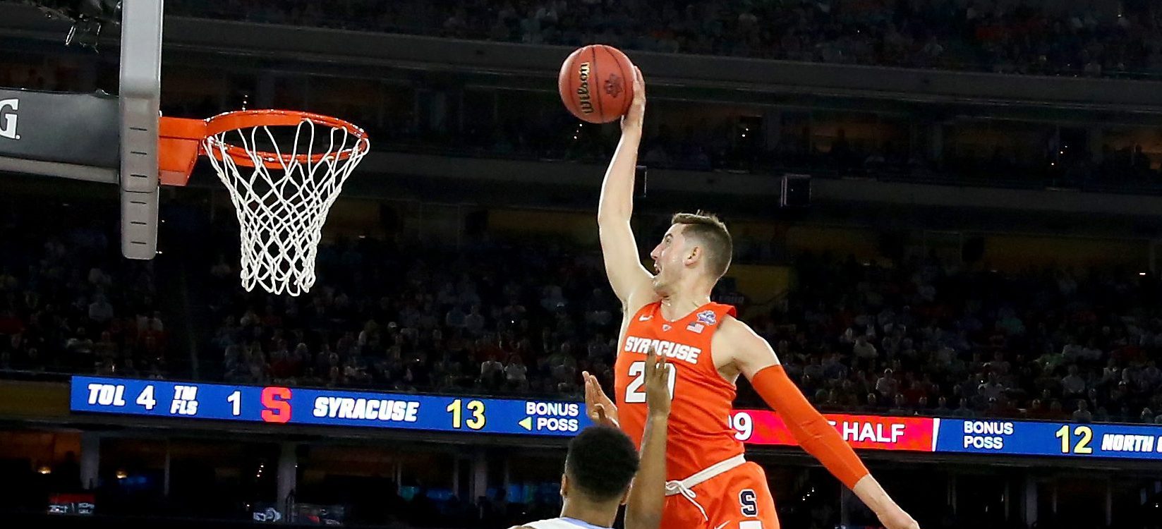 HOUSTON, TEXAS - APRIL 02: Tyler Lydon #20 of the Syracuse Orange attempts to dunk the ball against Isaiah Hicks #4 of the North Carolina Tar Heels in the first half during the NCAA Men's Final Four Semifinal at NRG Stadium on April 2, 2016 in Houston, Texas. (Photo by Ronald Martinez/Getty Images)