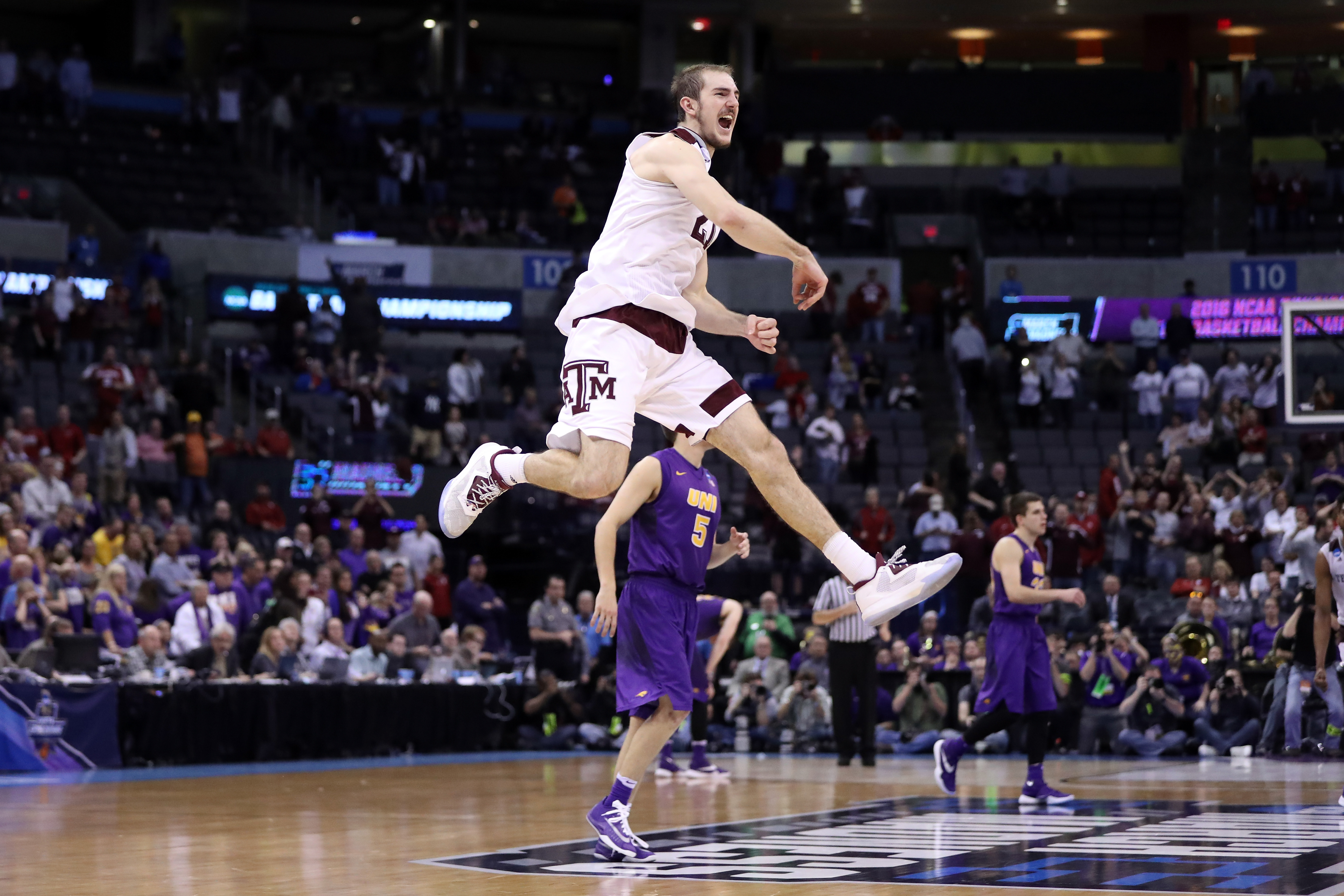 OKLAHOMA CITY, OK - MARCH 20: Alex Caruso #21 of the Texas A&M Aggies celebrates after defeating the Northern Iowa Panthers in double overtime with a score of 88 to 92 during the second round of the 2016 NCAA Men's Basketball Tournament at Chesapeake Energy Arena on March 20, 2016 in Oklahoma City, Oklahoma. (Photo by Ronald Martinez/Getty Images)