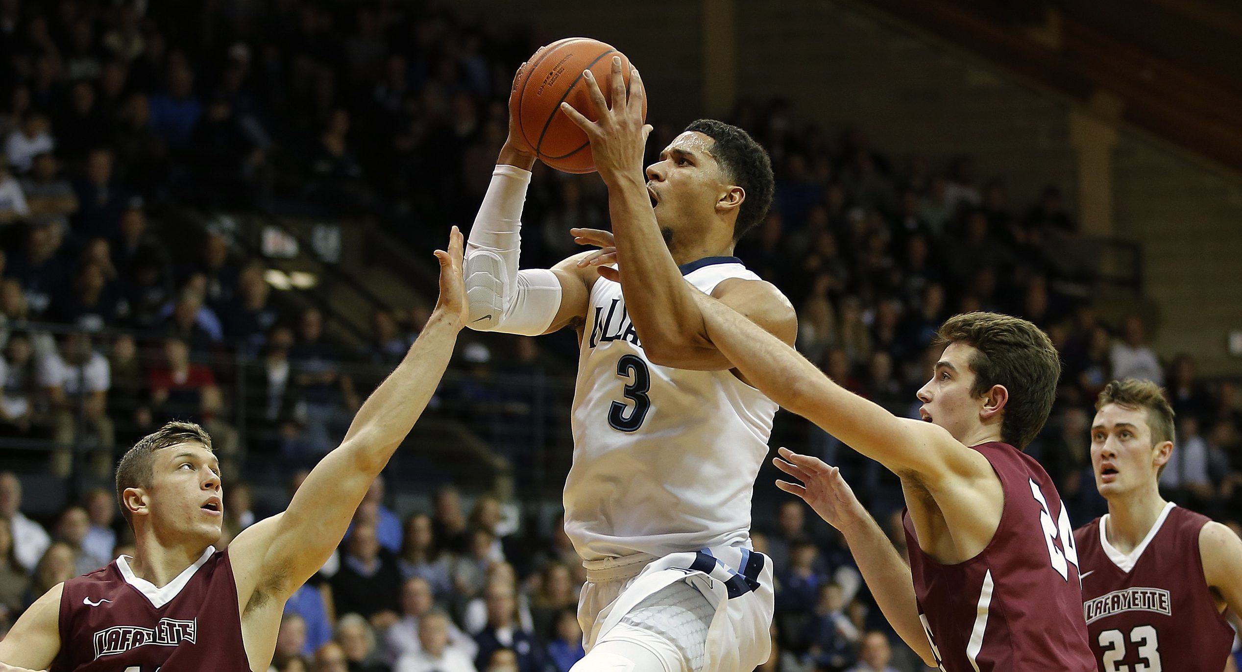 VILLANOVA, PA - NOVEMBER 11: Josh Hart #3 of Villanova attempts a shot as Nick Lindner #11 and Kyle Stout #24 of Lafayette defend during the second half of a game at The Pavilion on November 11, 2016 in Villanova, Pennsylvania. Villanova defeated Lafayette 88-48. (Photo by Rich Schultz/Getty Images)