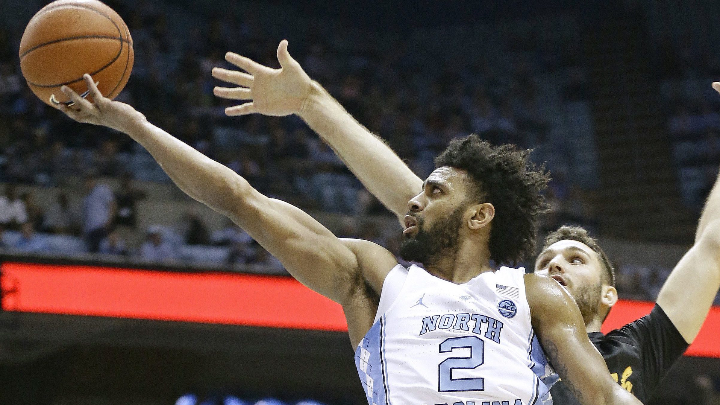 North Carolina's Joel Berry II (2) drives to the basket against Long Beach State's Gabe Levin (0) during the first half of an NCAA college basketball game in Chapel Hill, N.C., Tuesday, Nov. 15, 2016. (AP Photo/Gerry Broome)