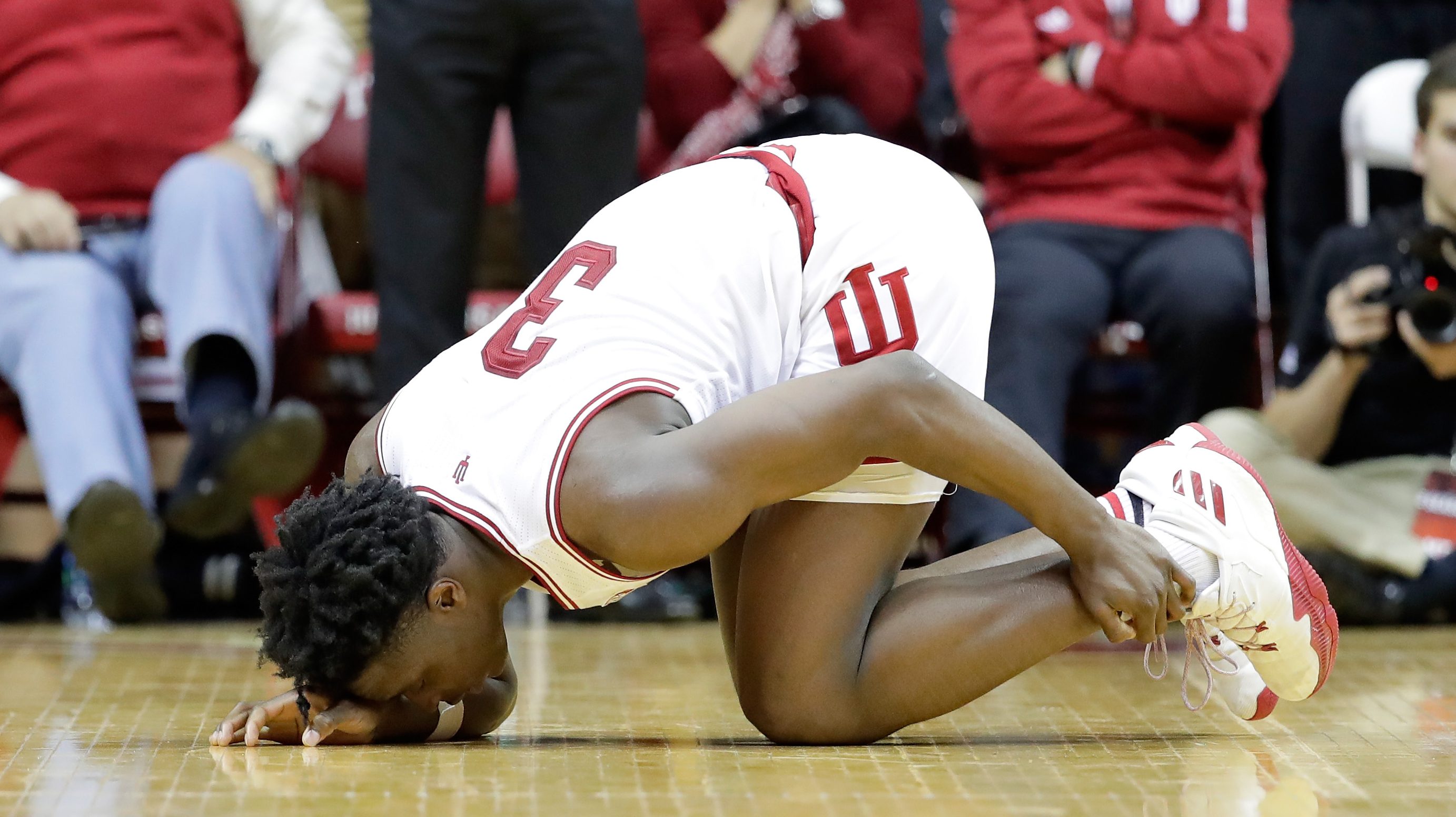 BLOOMINGTON, IN - NOVEMBER 30: O G Anunoby #3 of the Indiana Hoosiers grabs his ankle after being injured during the game against the North Carolina Tar Heels at Assembly Hall on November 30, 2016 in Bloomington, Indiana. (Photo by Andy Lyons/Getty Images)