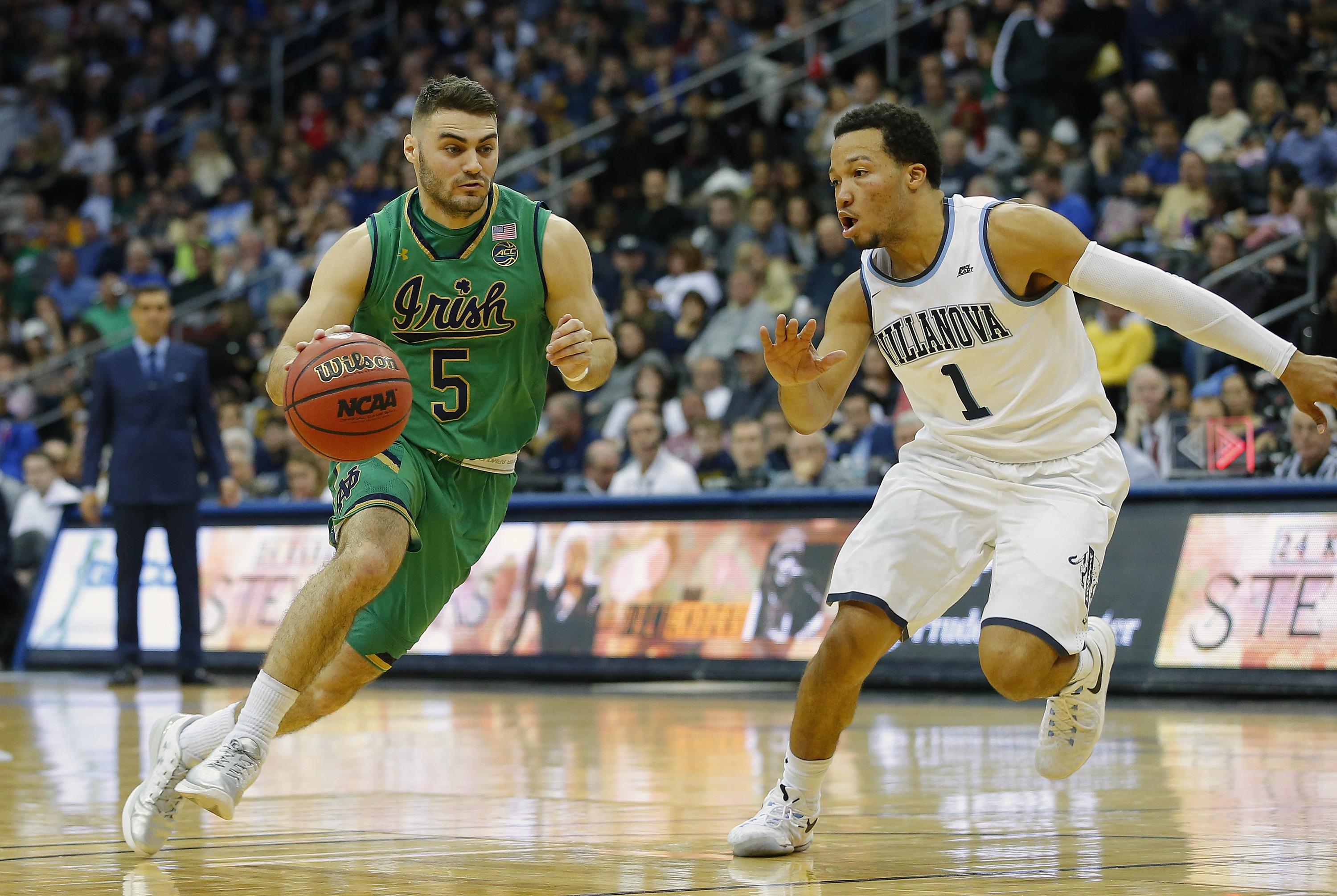 NEWARK, NJ - DECEMBER 10: Matt Farrell #5 of the Notre Dame Fighting Irish drives to the basket as Jalen Brunson #1 of the Villanova Wildcats defends during the second half of a college basketball game at Prudential Center on December 10, 2016 in Newark, New Jersey. Villanova defeated Notre Dame 74-66. (Photo by Rich Schultz/Getty Images)