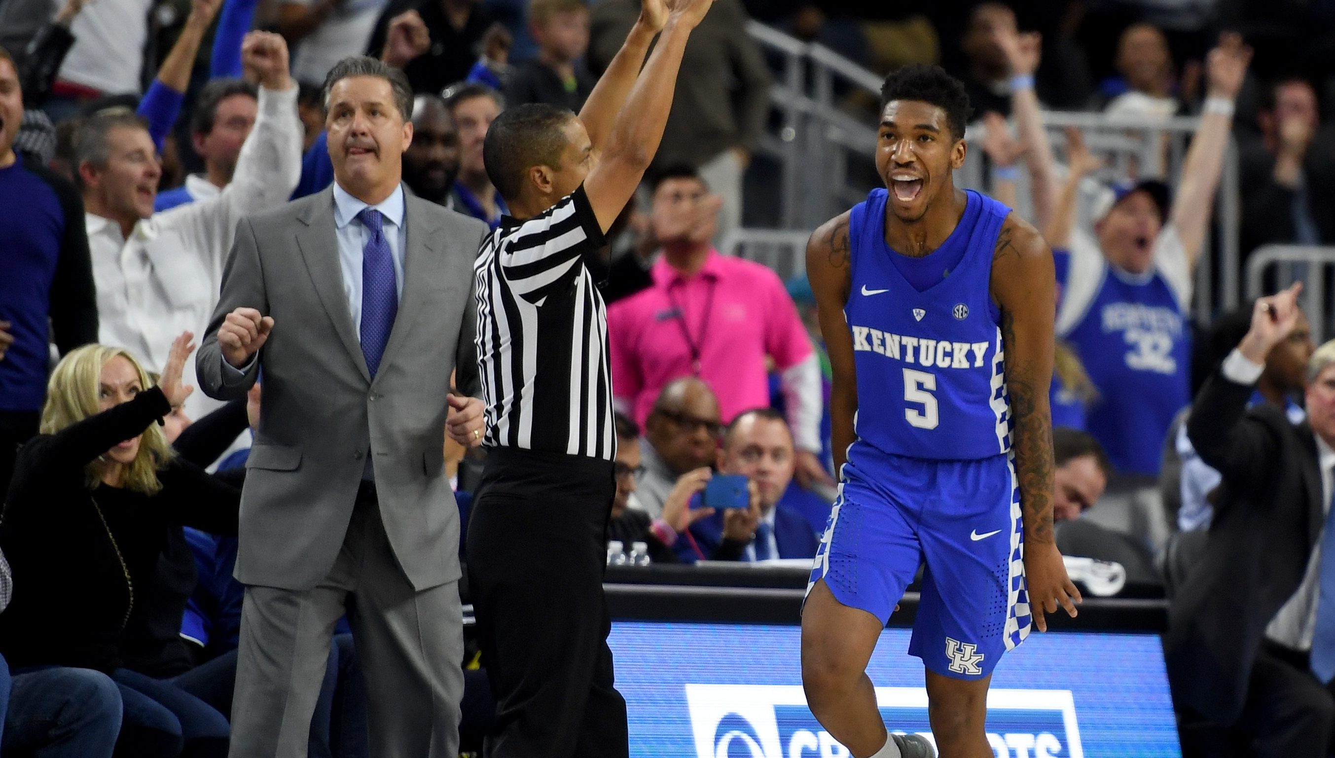 LAS VEGAS, NV - DECEMBER 17: Head coach John Calipari of the Kentucky Wildcats looks on as Malik Monk #5 celebrates after hitting a go-ahead 3-pointer late in the team's 103-100 win over the North Carolina Tar Heels during the CBS Sports Classic at T-Mobile Arena on December 17, 2016 in Las Vegas, Nevada. (Photo by Ethan Miller/Getty Images)