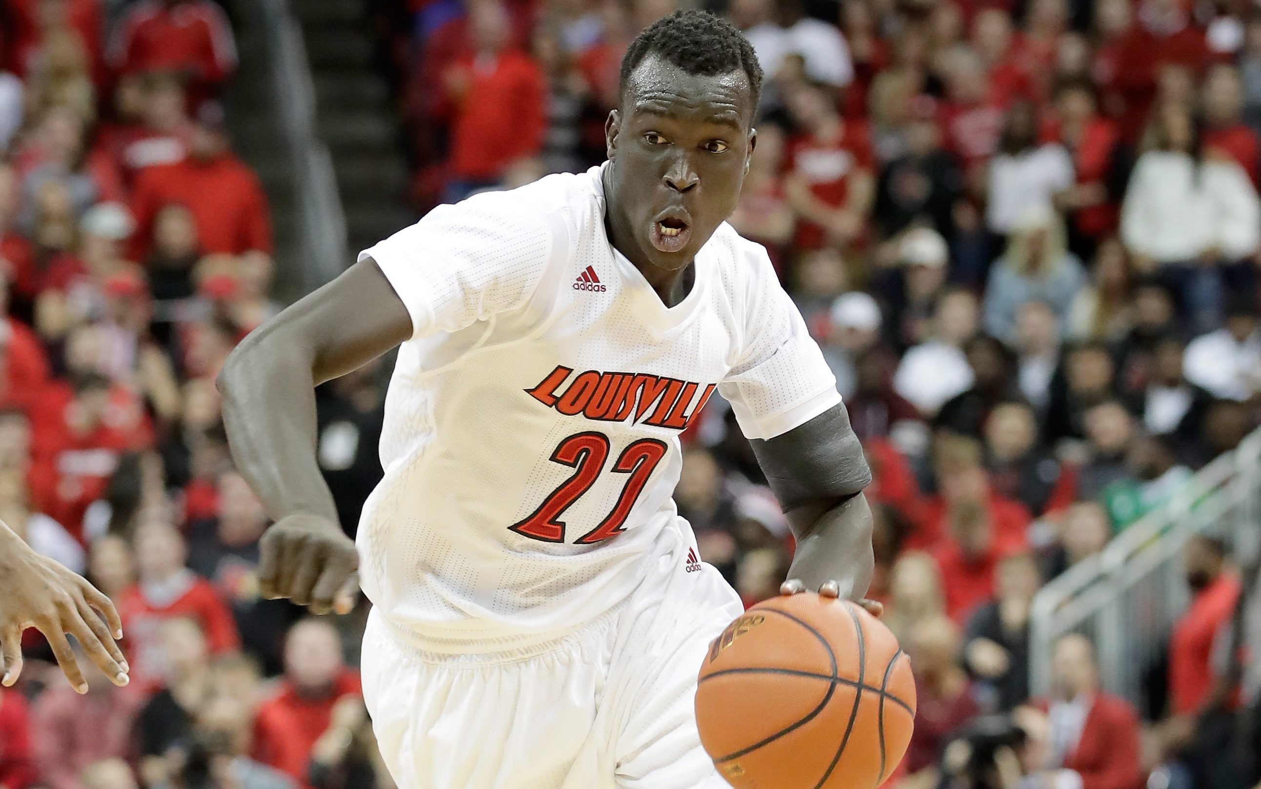 LOUISVILLE, KY - DECEMBER 21: Deng Adel #22 of the Louisville Cardinals dribbles the ball during the game against the Kentucky Wildcats at KFC YUM! Center on December 21, 2016 in Louisville, Kentucky. (Photo by Andy Lyons/Getty Images)