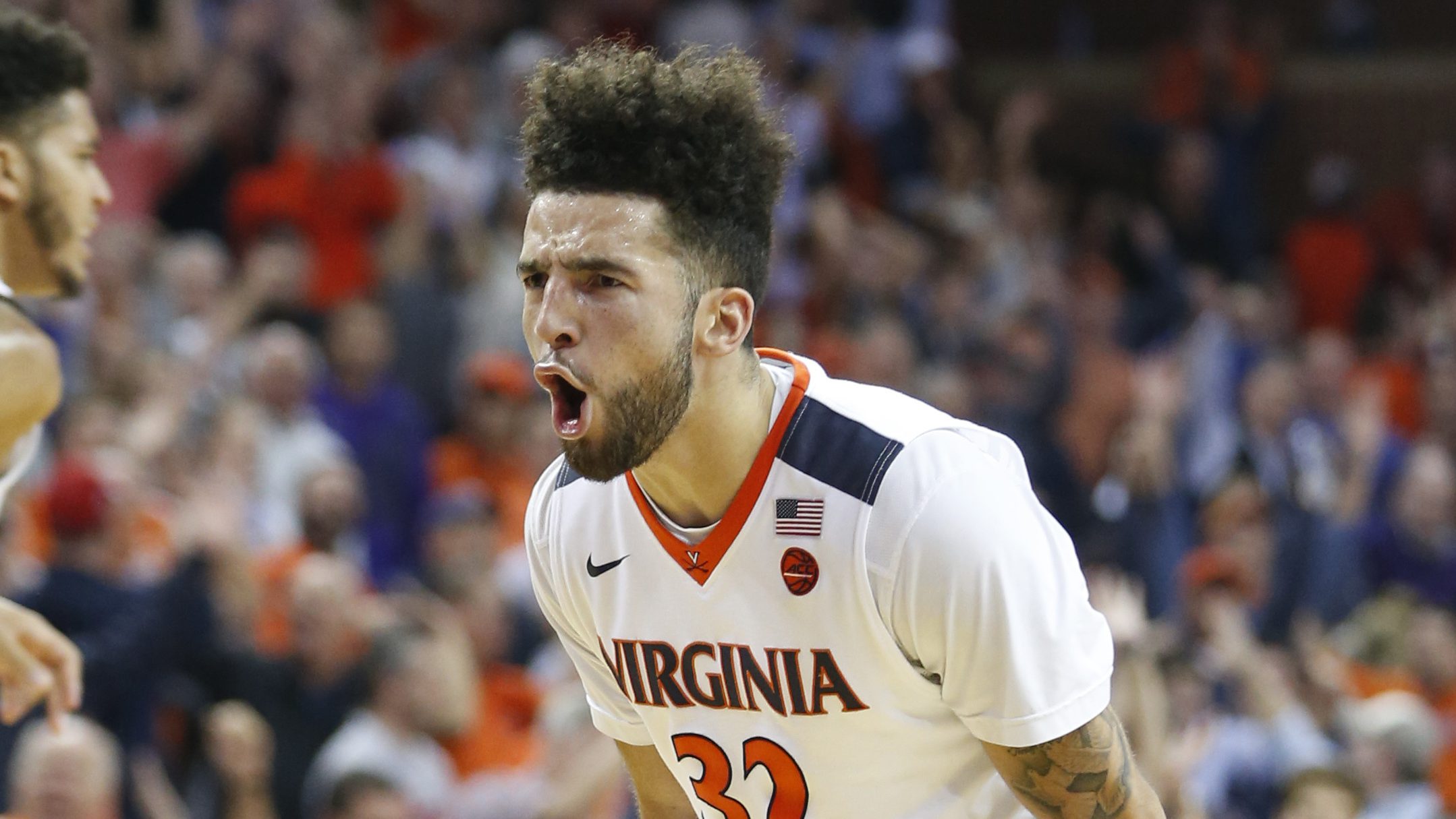 Virginia guard London Perrantes (32) reacts to a three pointer during the second half of an NCAA college basketball game in Charlottesville, Va., Wednesday, Nov. 30, 2016. Virginia won the game 63-61. (AP Photo/Steve Helber)