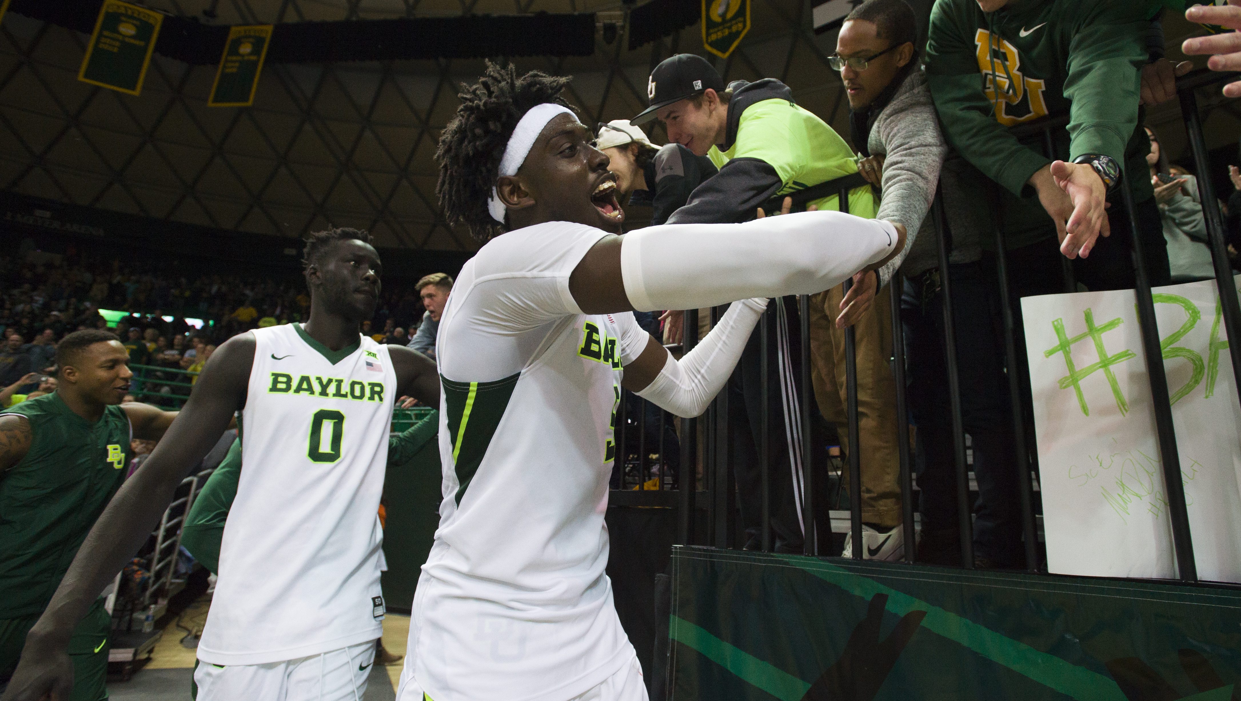 WACO, TX - JANUARY 7: Johnathan Motley #5 and Jo Lual-Acuil Jr. #0 of the Baylor Bears celebrate after defeating the Oklahoma State Cowboys 61-57 on January 7, 2017 at the Ferrell Center in Waco, Texas.  (Photo by Cooper Neill/Getty Images)