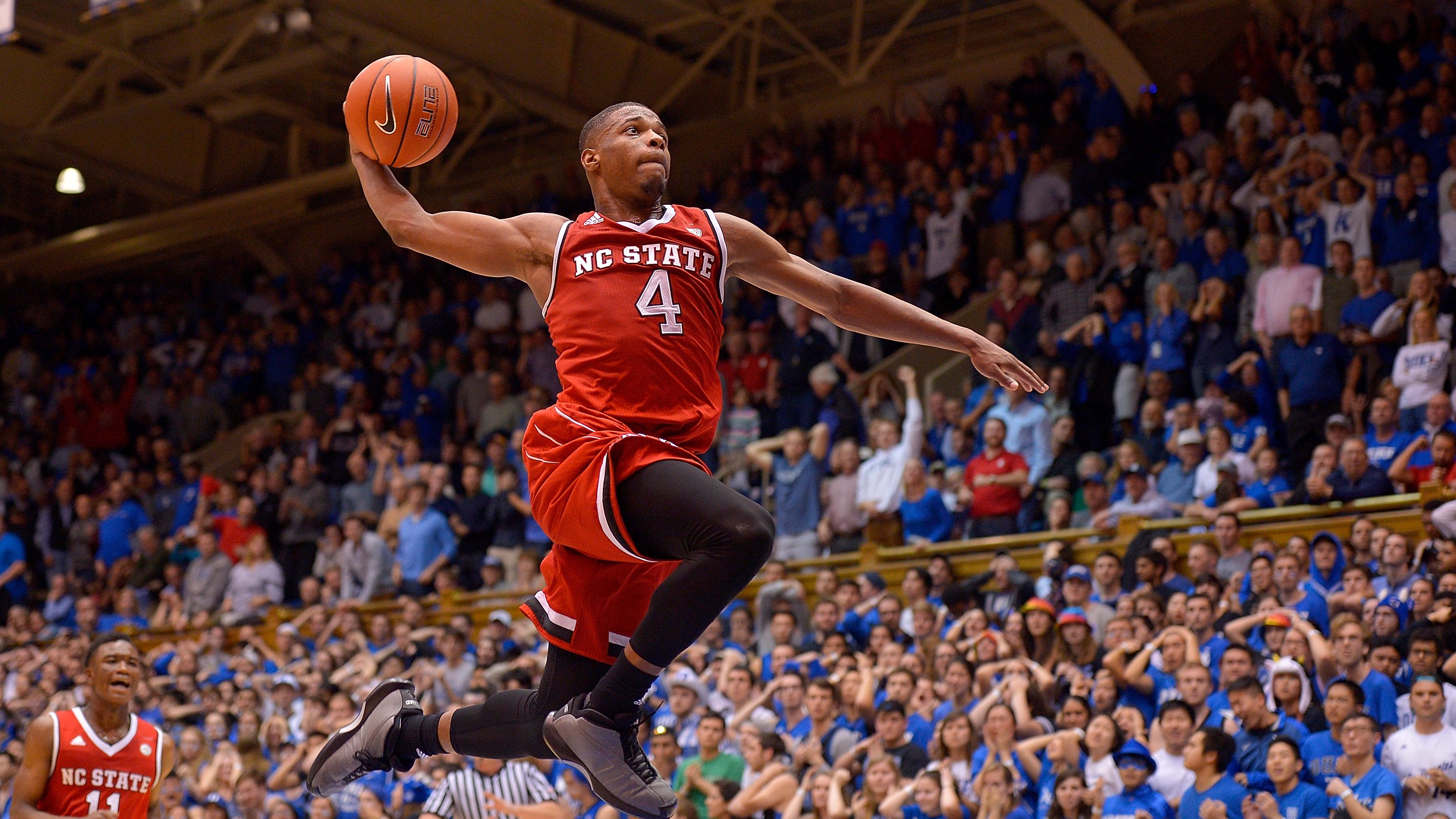 DURHAM, NC - JANUARY 23:  Dennis Smith Jr. #4 of the North Carolina State Wolfpack drives in for a dunk as time expires during their win against the Duke Blue Devils at Cameron Indoor Stadium on January 23, 2017 in Durham, North Carolina. North Carolina State won 84-82.  (Photo by Grant Halverson/Getty Images)