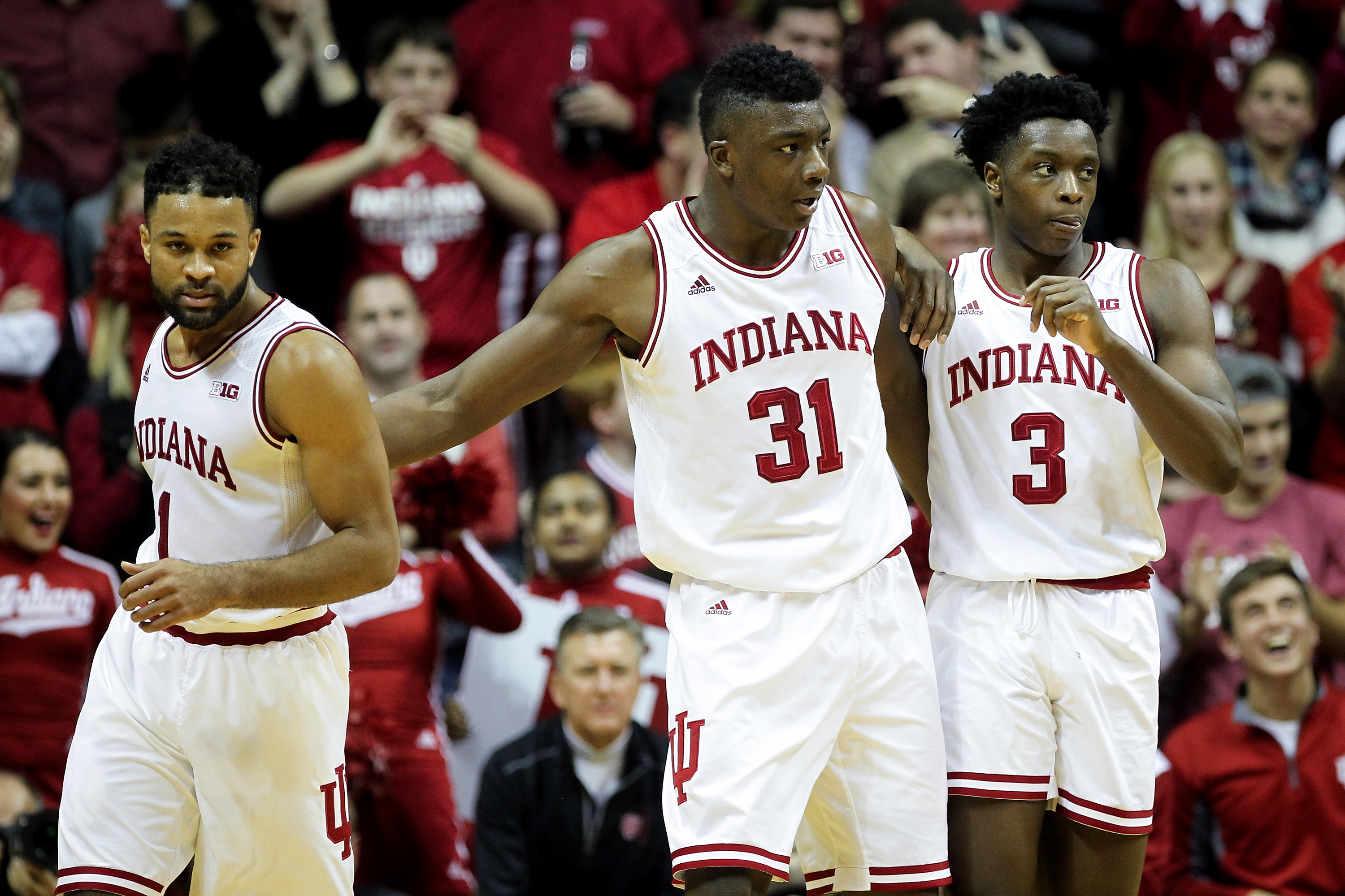 BLOOMINGTON, IN - DECEMBER 28: James Blackmon Jr. #1, Thomas Bryant #31, and OG Anunoby #3 of the Indiana Hoosiers meet in the second half against the Nebraska Cornhuskers at Assembly Hall on December 28, 2016 in Bloomington, Indiana. (Photo by Dylan Buell/Getty Images)
