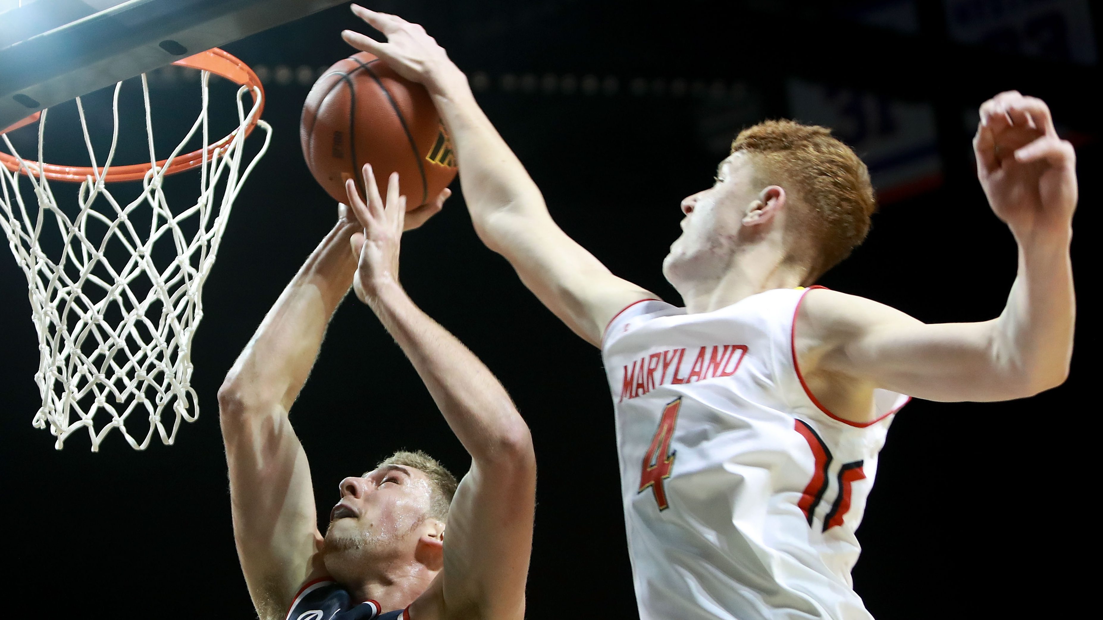 NEW YORK, NY - NOVEMBER 25:  Kevin Huerter #4 of the Maryland Terrapins blocks T.J. Cline #10 of the Richmond Spiders in the second half during the Barclays Center Classic at Barclays Center on November 25, 2016 in the Brooklyn borough of New York City.  (Photo by Michael Reaves/Getty Images)