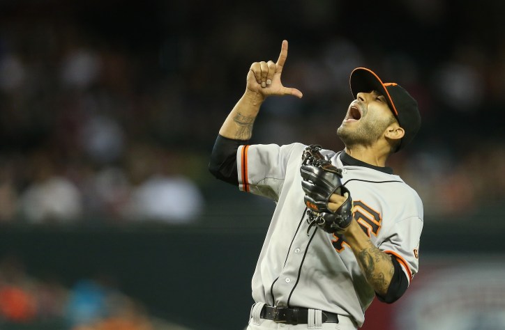 PHOENIX, AZ - JUNE 22: Relief pitcher Sergio Romo #54 of the San Francisco Giants celebrates after defeating the Arizona Diamondbacks in the MLB game at Chase Field on June 22, 2014 in Phoenix, Arizona. The Giants defeated the Diamondbacks 4-1. (Photo by Christian Petersen/Getty Images)