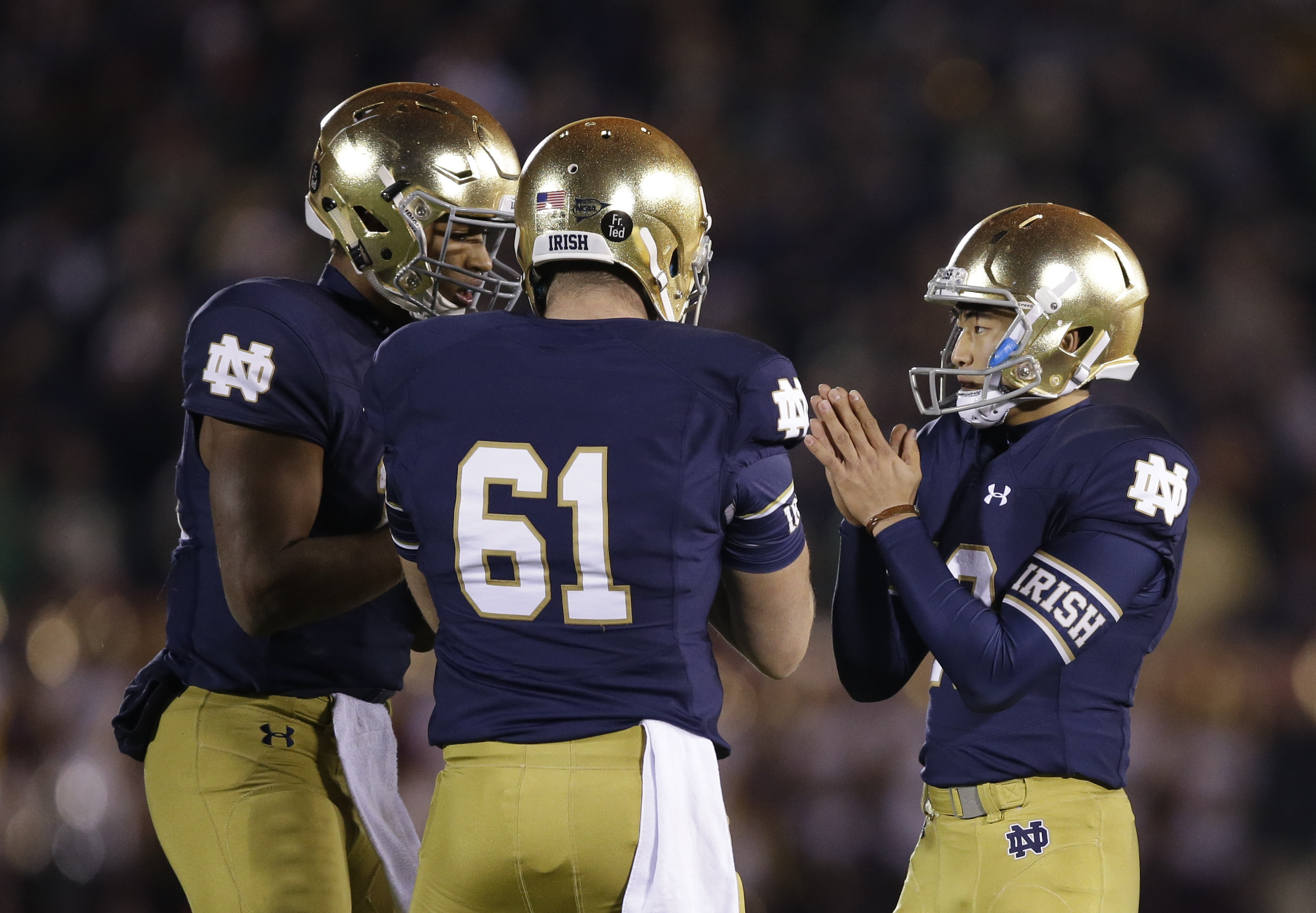 Notre Dame's Justin Yoon, right, celebrates with his teammates after Yoon kicked a 32-yard field goal during the second half of an NCAA college football game against Southern California, Saturday, Oct. 17, 2015, in South Bend, Ind. Notre Dame won the game 41-31. (AP Photo/Darron Cummings)