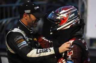 MARTINSVILLE, VA - NOVEMBER 01: Jeff Gordon, driver of the #24 AARP Member Advantages Chevrolet, is congratulated by Jimmie Johnson, driver of the #48 KOBALT TOOLS Chevrolet, after winning the NASCAR Sprint Cup Series Goody's Headache Relief Shot 500 at Martinsville Speedway on November 1, 2015 in Martinsville, Virginia. (Photo by Rainier Ehrhardt/Getty Images)