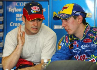 CONCORD, NC - MAY 25: Jeff Gordon, driver of the #24 Dupont Chevrolet speaks with Kyle Busch, driver of the #5 Kellogg's Chevrolet, during NASCAR Nextel Cup Series Coca-Cola 600 practice on May 25, 2006 at Lowes Motor Speedway in Concord, North Carolina. (Photo by Rusty Jarrett/Getty Images for NASCAR)
