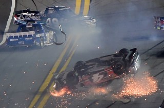 DAYTONA BEACH, FL - FEBRUARY 19: Christopher Bell, driver of the #4 JBL Toyota, Timmy Hill, driver of the #49 Hormone Therapeutics Chevrolet, and John H Nemechek, driver of the #8 farbe technik Chevrolet, have an on track incident during the NASCAR Camping World Truck Series NextEra Energy Resources 250 at Daytona International Speedway on February 19, 2016 in Daytona Beach, Florida. (Photo by Jared C. Tilton/Getty Images)