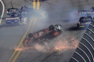 DAYTONA BEACH, FL - FEBRUARY 19: Christopher Bell, driver of the #4 JBL Toyota, Timmy Hill, driver of the #49 Hormone Therapeutics Chevrolet, and John H Nemechek, driver of the #8 farbe technik Chevrolet, have an on track incident during the NASCAR Camping World Truck Series NextEra Energy Resources 250 at Daytona International Speedway on February 19, 2016 in Daytona Beach, Florida. (Photo by Jared C. Tilton/Getty Images)